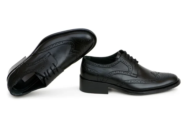 Zwarte schoenen geïsoleerd op de witte — Stockfoto
