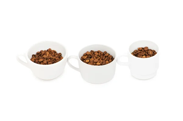 Trzy białe pełne kawy filiżanki — Zdjęcie stockowe