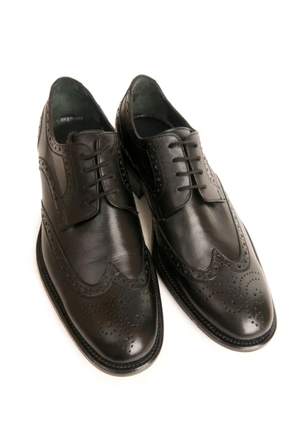 Schwarze Schuhe isoliert auf dem weißen — Stockfoto