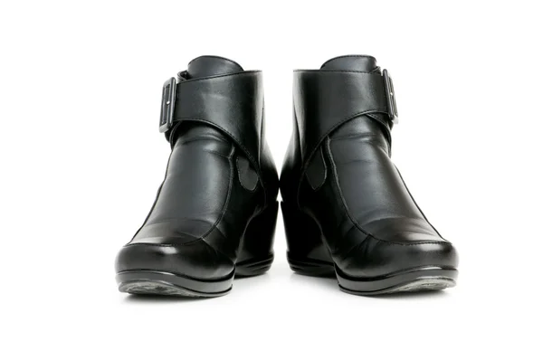 Zwarte laarzen geïsoleerd op de witte — Stockfoto