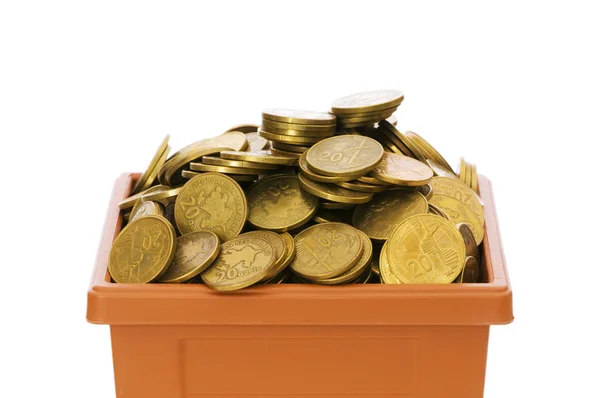 Många mynt i lerkruka — Stockfoto
