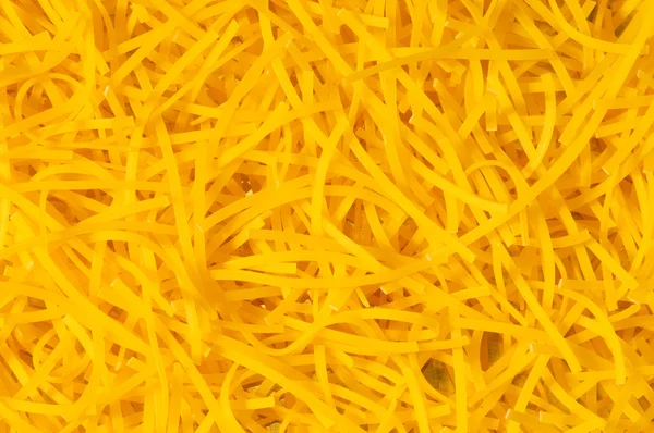 Extremo close-up de massa amarela — Fotografia de Stock