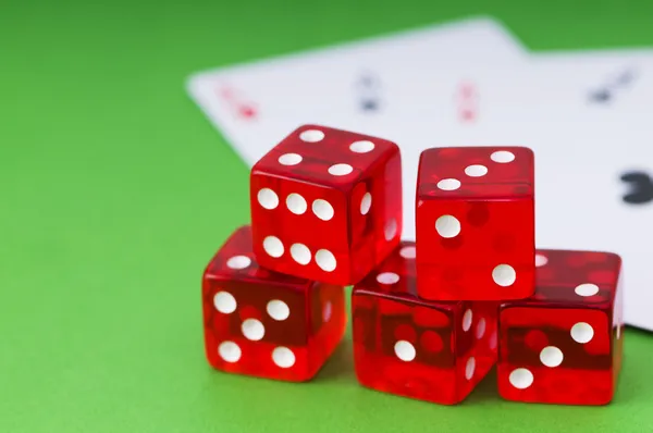 Red dice and cards at the green — Stock Photo, Image