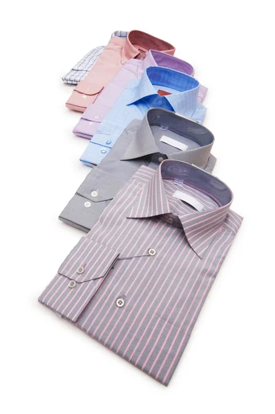 Varie camicie isolate sul bianco — Foto Stock