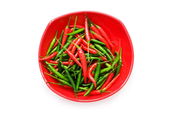 Peppers in plate isolated — Stock Photo, Image