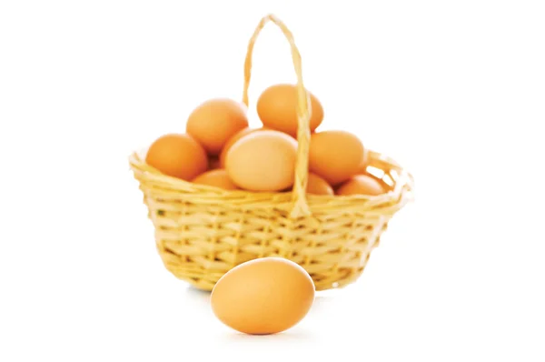 Basket full of eggs isolated — Stock Photo, Image