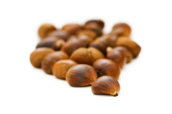 Many chestnuts isolated on the white — Stock Photo, Image