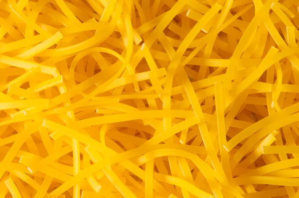 Ekstrem nærbillede af gul pasta - Stock-foto