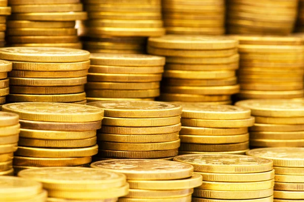 Close up van gouden munten stapels — Stockfoto
