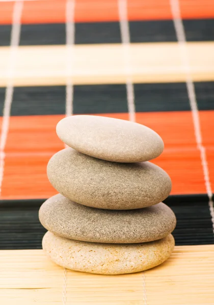 Stack of spa pebbles isolated Stock Picture