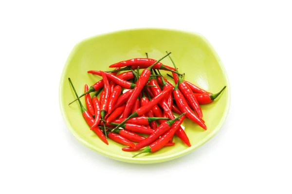 Papriky v deska izolovaná — Stock fotografie