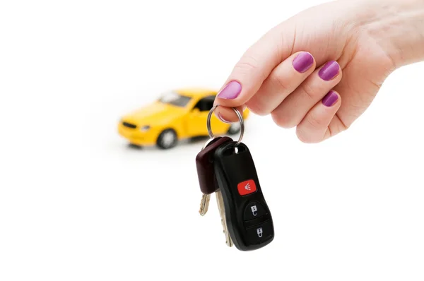 Car keys and car at background — Stock Photo, Image