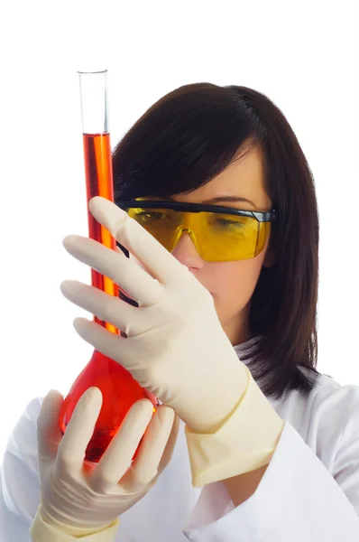 Женщина с химическими трубками — стоковое фото