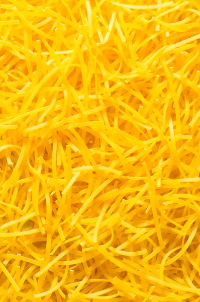 Extreme close up of yellow pasta — Stock Photo, Image