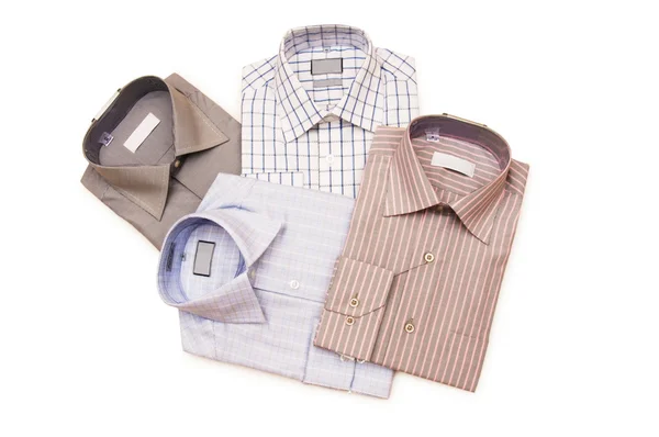 Várias camisas isoladas no branco — Fotografia de Stock