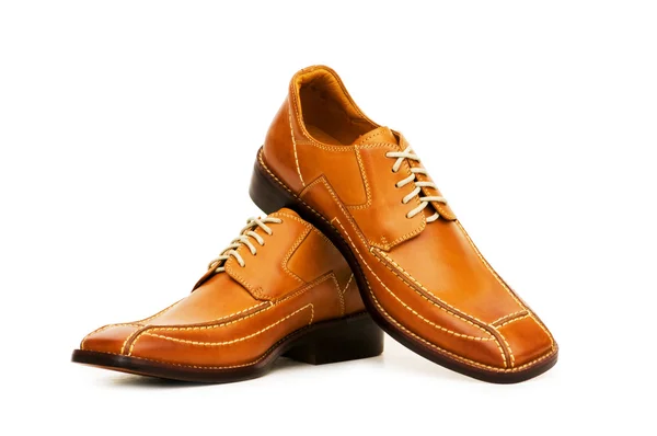Оранжевые туфли на белом — стоковое фото