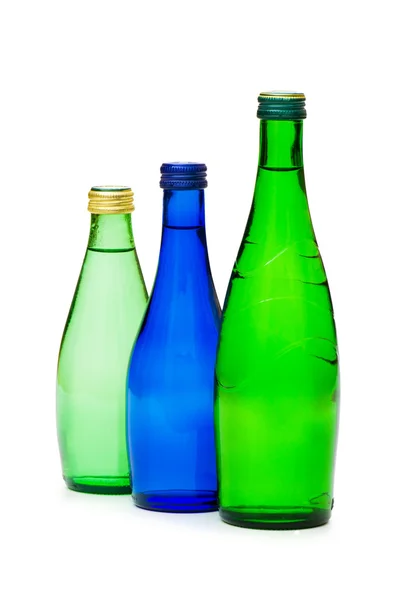 Flaskor vatten isolerade — Stockfoto