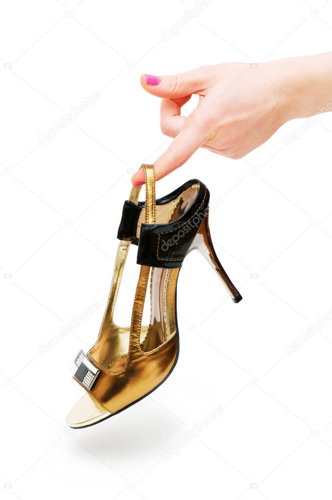 Hand holding woman shoe isolated
