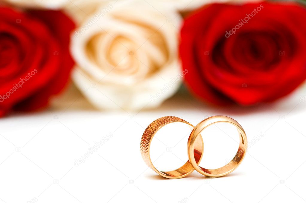 Roses and wedding ring isolated