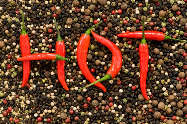 The word HOT on the pepper — Stock Photo, Image