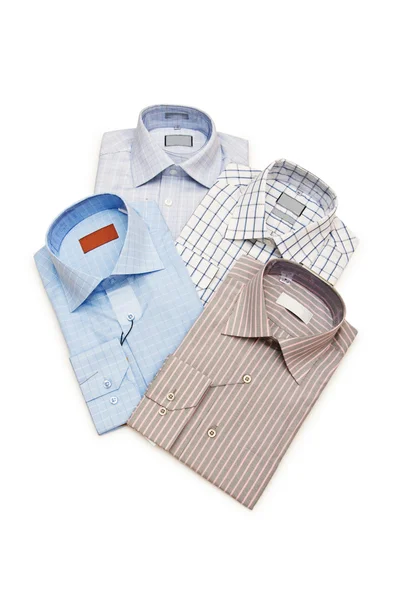Várias camisas isoladas no branco — Fotografia de Stock
