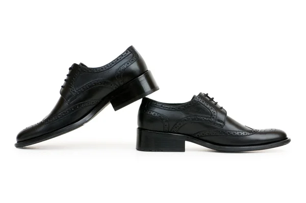 Черные туфли на белом — стоковое фото