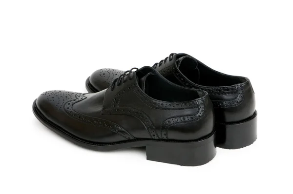 Zapatos negros aislados en el blanco — Foto de Stock