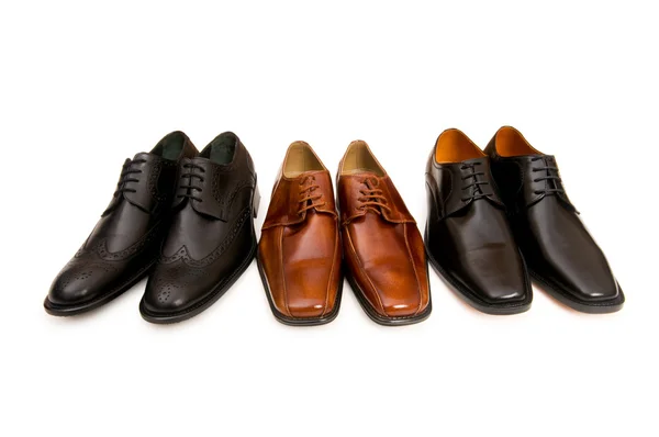 Selection of male shoes isolated Royalty Free Stock Images