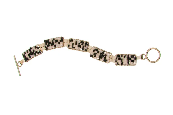 Armband mit Steinen auf dem weißen — Stockfoto