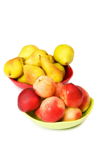 Plates with peaches and nectarines — Stock Photo, Image