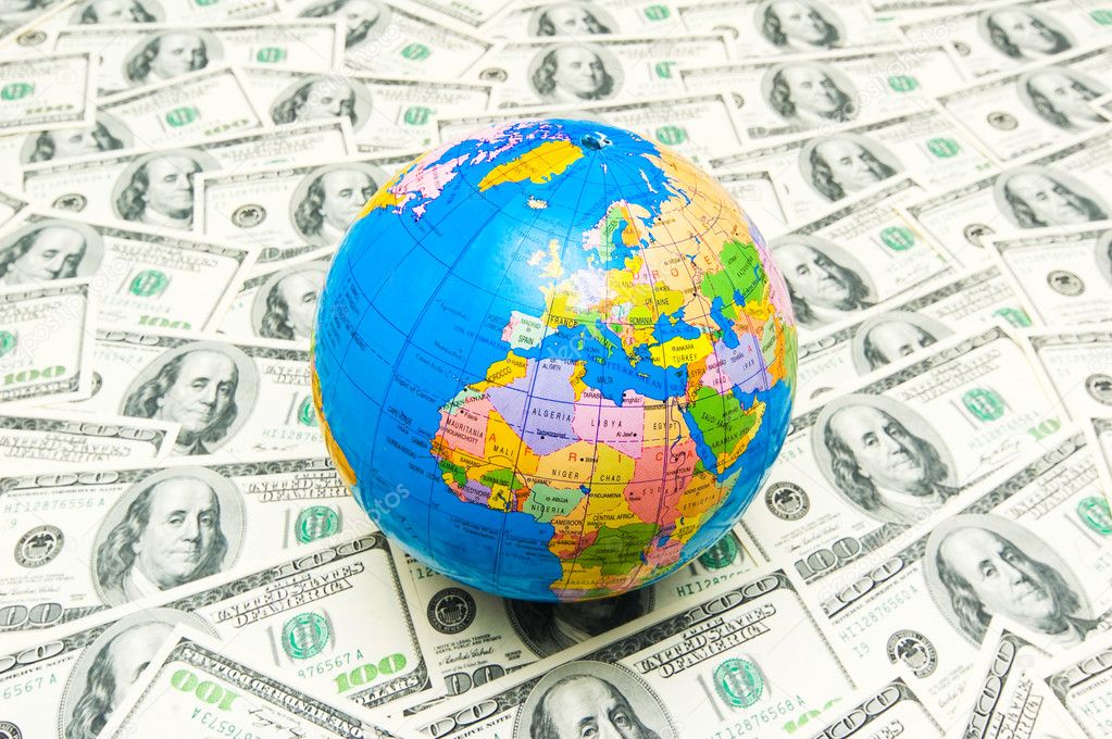 Globe over many american dollars