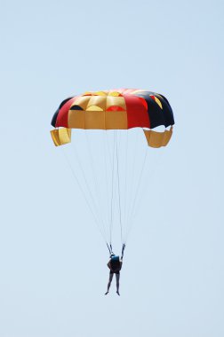 Multi coloured parachute over the sky clipart