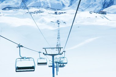 Ski lifts on the bright day clipart