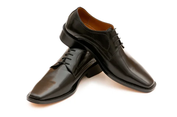 Zwarte schoenen geïsoleerd op de witte — Stockfoto