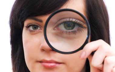 Eye magnified through magnified glass clipart