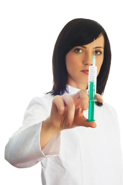 Mulher verificando seringa isolada — Fotografia de Stock