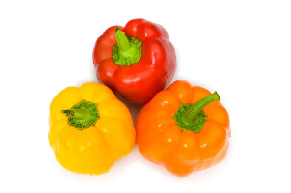 Tři červené papriky, samostatný — Stock fotografie