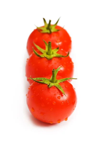 Tres tomates aislados en el blanco — Foto de Stock