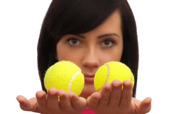 Menina segurando duas bolas de tênis — Fotografia de Stock
