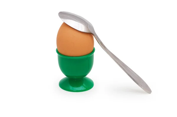 Brązowy jajko w uchwycie na białym tle — Zdjęcie stockowe