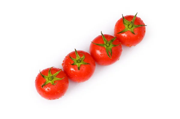 Ряд помидоров изолированы на белом — стоковое фото