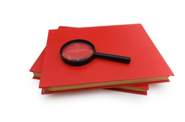 Magnifying glass over the books — Stock Photo, Image
