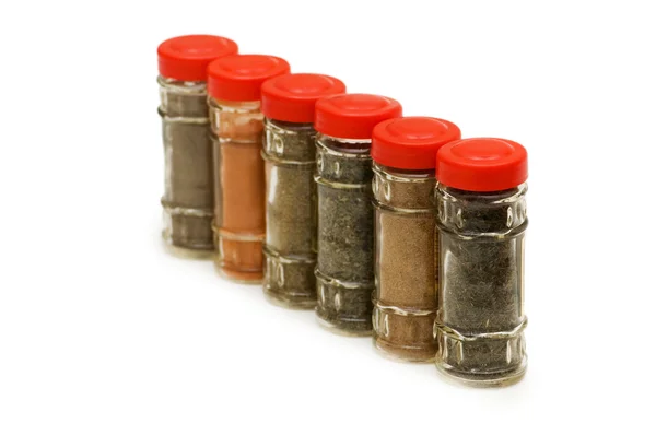 Spice bottles isolated on the white — Stock Photo, Image