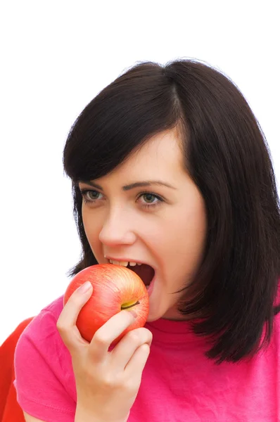 Girl biting red apple isolated — Stock Photo, Image