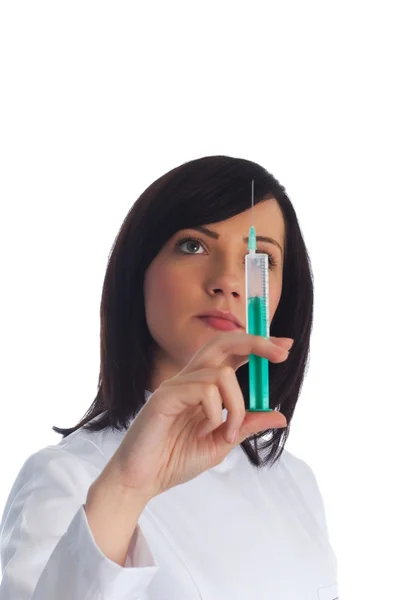 Woman checking syringe isolated — Stock Photo, Image