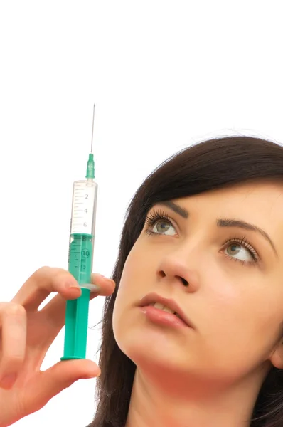 Woman checking syringe isolated — Stock Photo, Image