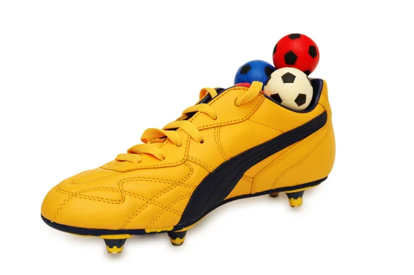 Żółte buty i piłki — Zdjęcie stockowe