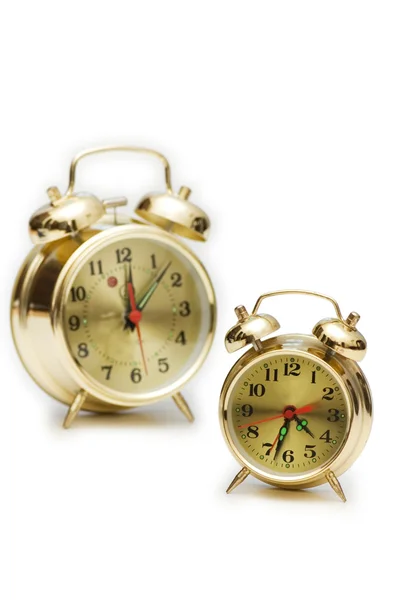 Relógios de alarme dourados isolados — Fotografia de Stock