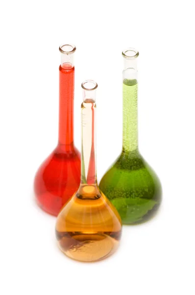 Três tubos com produtos químicos isolados — Fotografia de Stock