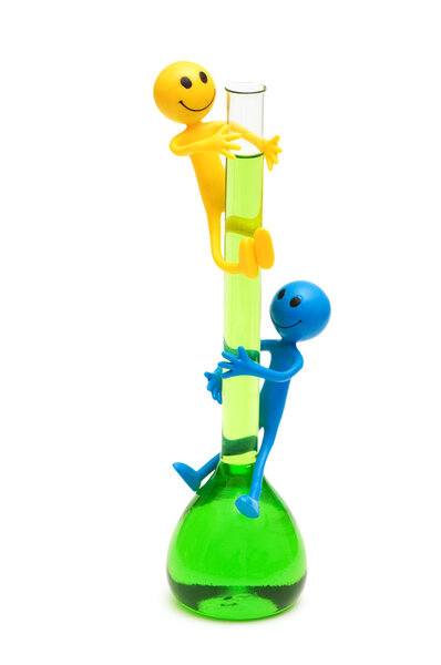 Smilies holding green tube